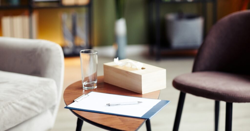 therapy office with chairs and tissue box to receive talk therapy for anxiety