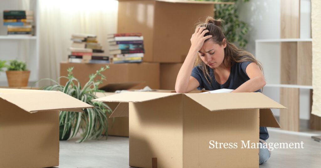 woman holding head stressed about moving and needing life transition therapy